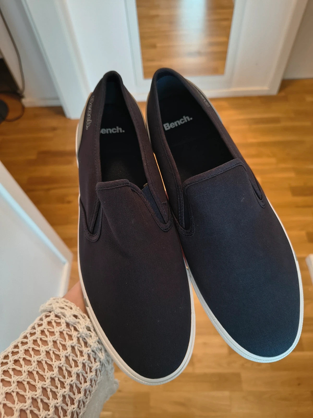 Bench blue slip-on trainers with light sole and gray heel detail.
