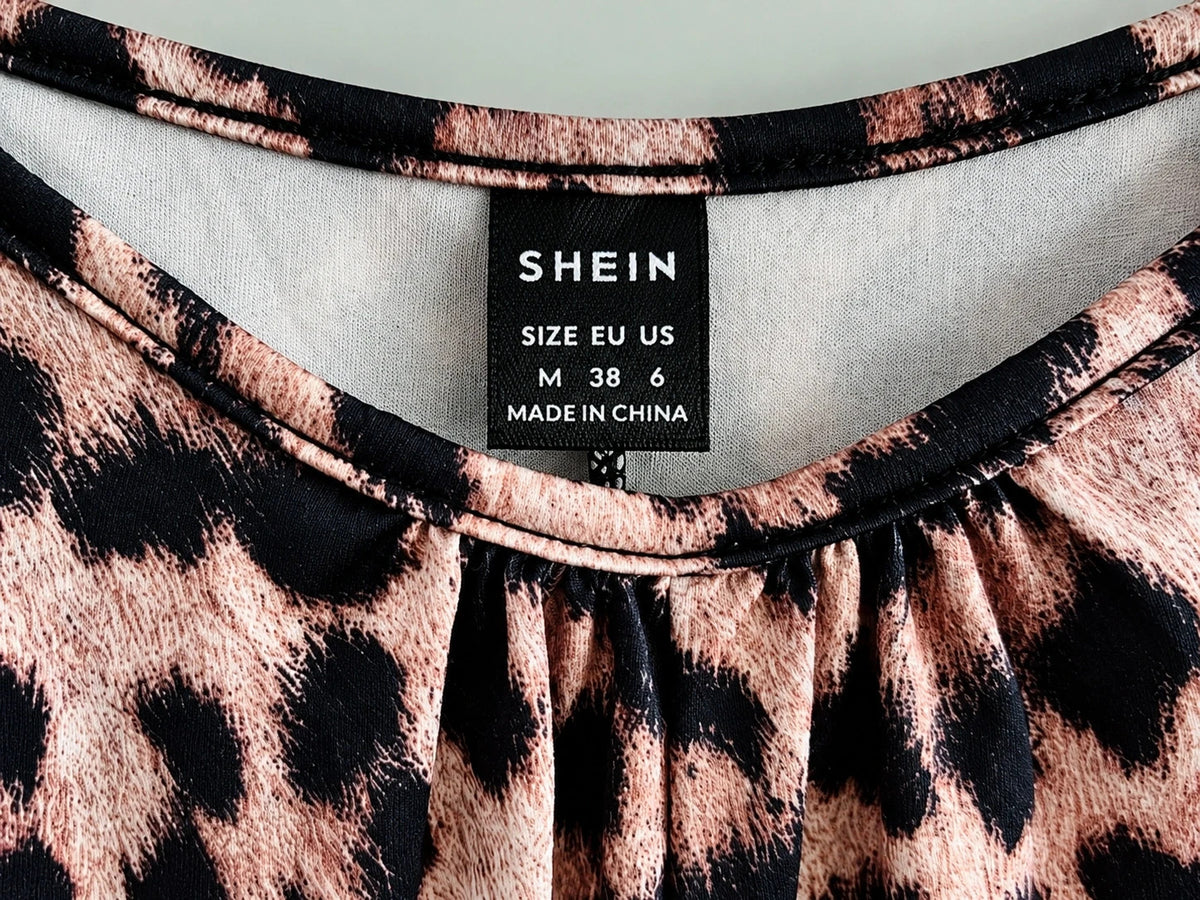 SheIn beige and brown leopard print jumpsuit with thin straps and wide legs.