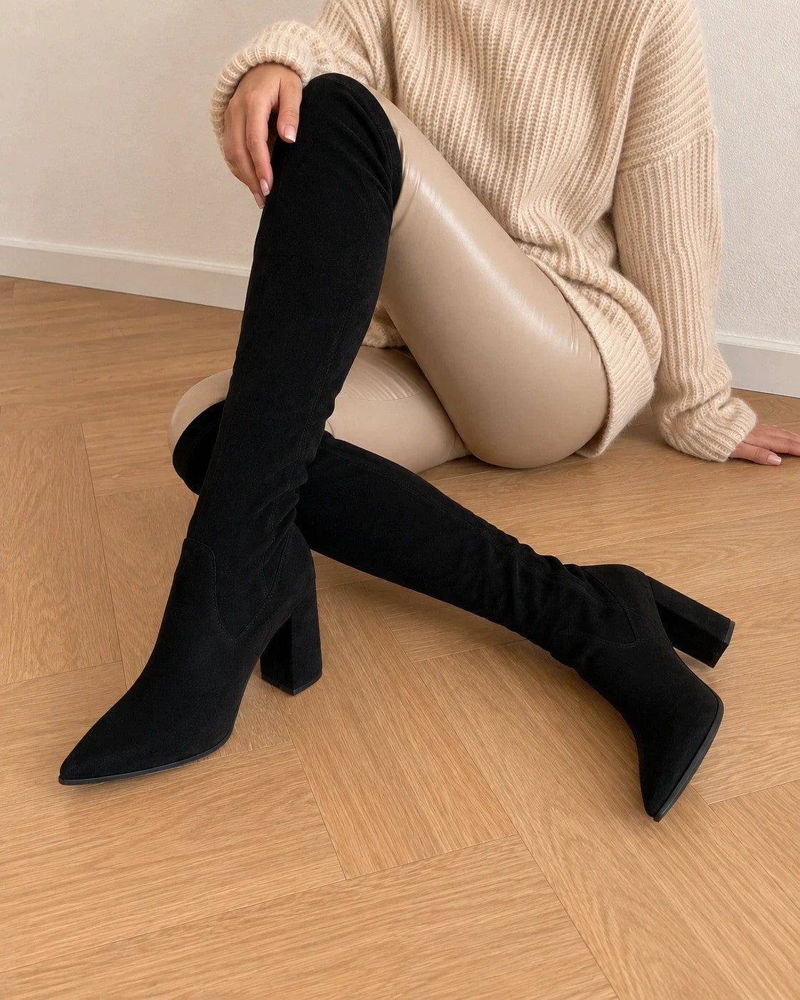REI brown overknee slip-on boots in soft suede look with pointed toe and block heel.