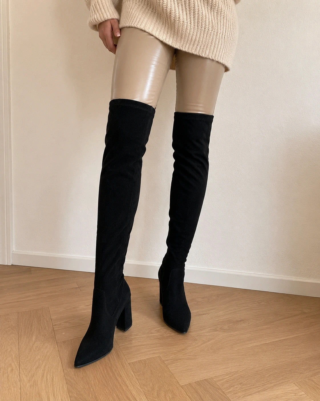 REI brown overknee slip-on boots in soft suede look with pointed toe and block heel.