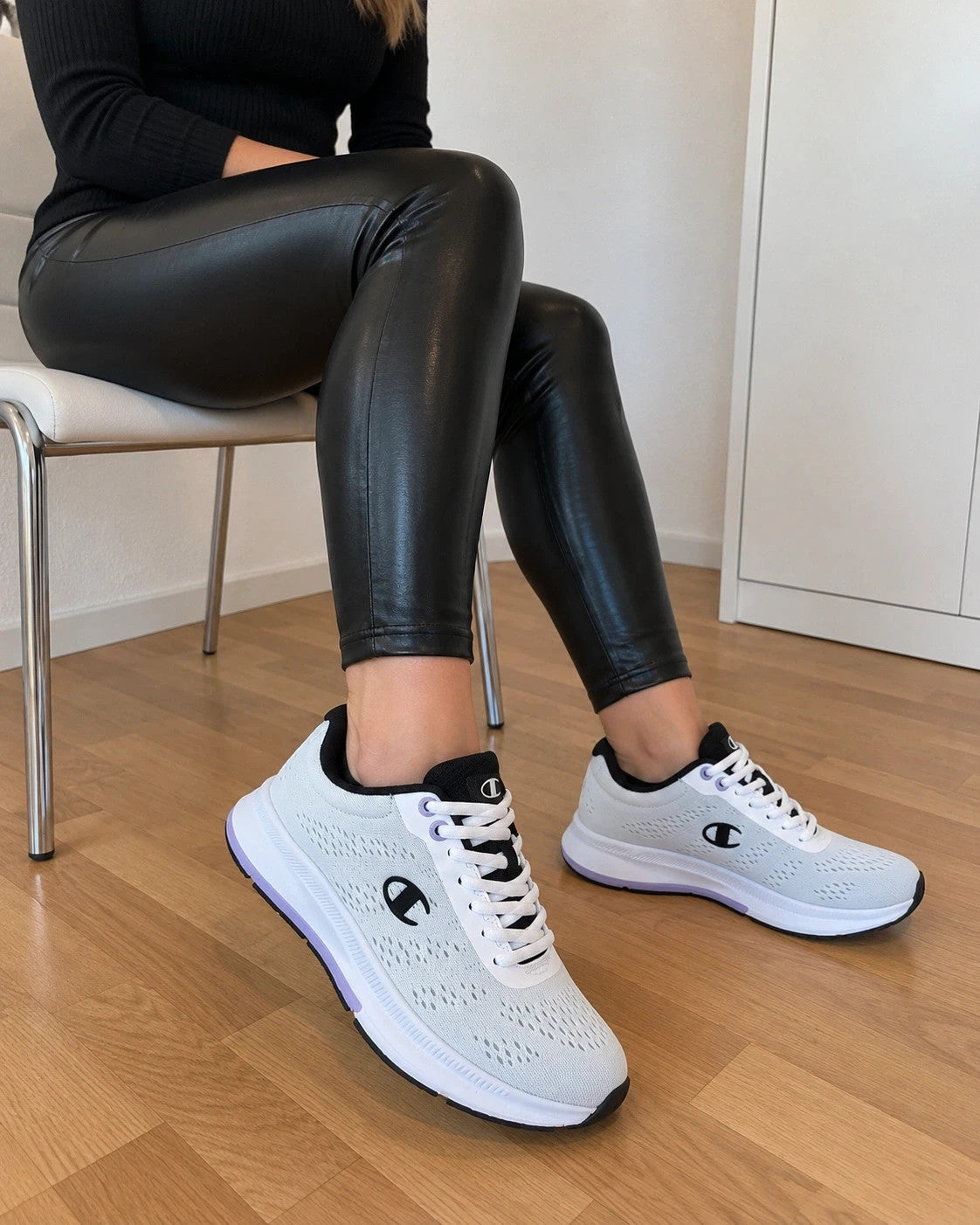 Champion white trainers with black and subtle lilac details, lightweight textile material.