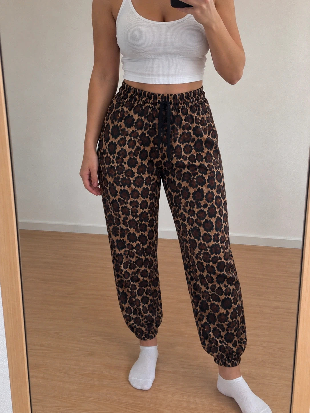 SheIn joggers black and brown leopard print, elastic waistband, lightweight synthetic material.
