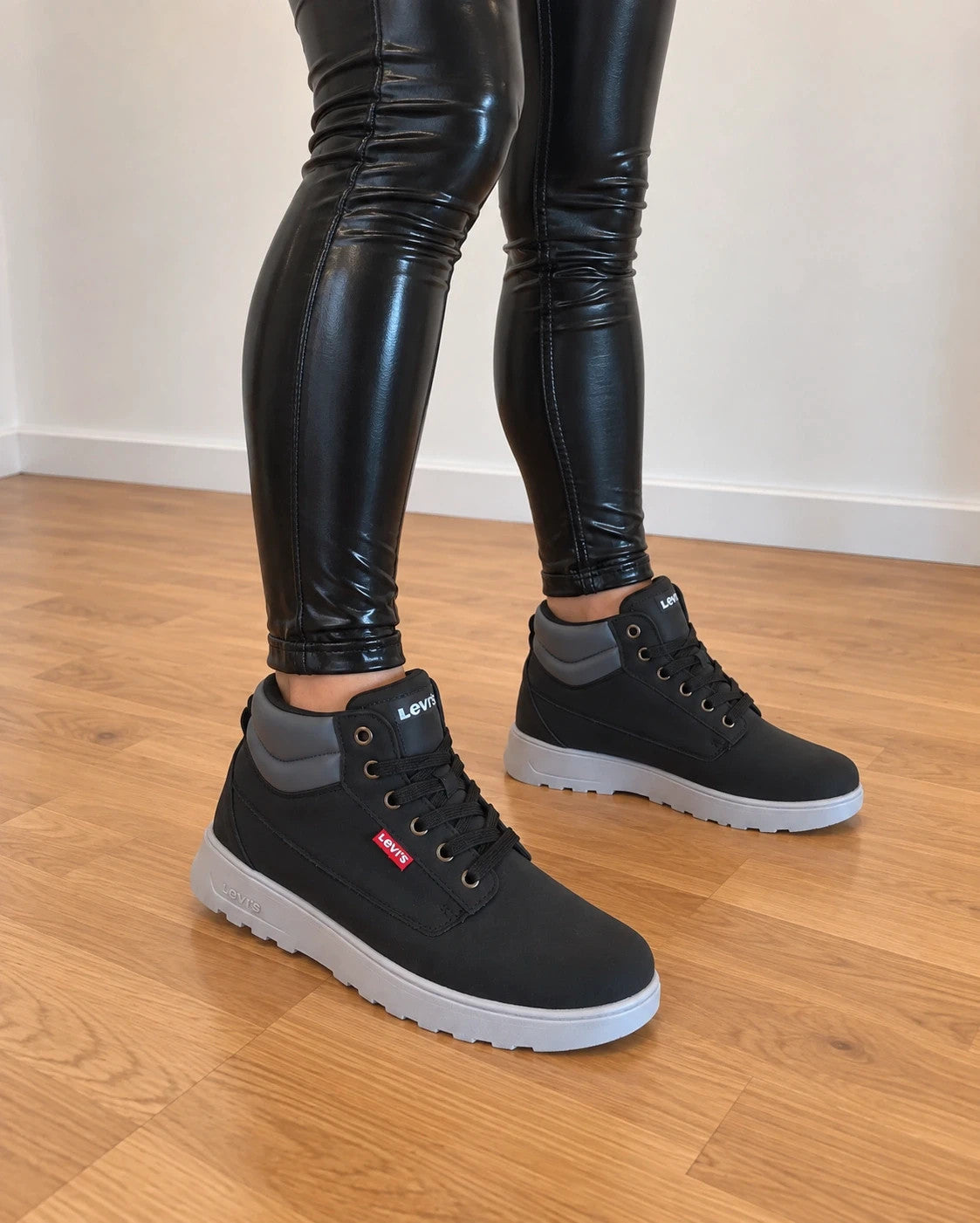 Levi's black and grey sneaker boots with logo details and padded high shaft.