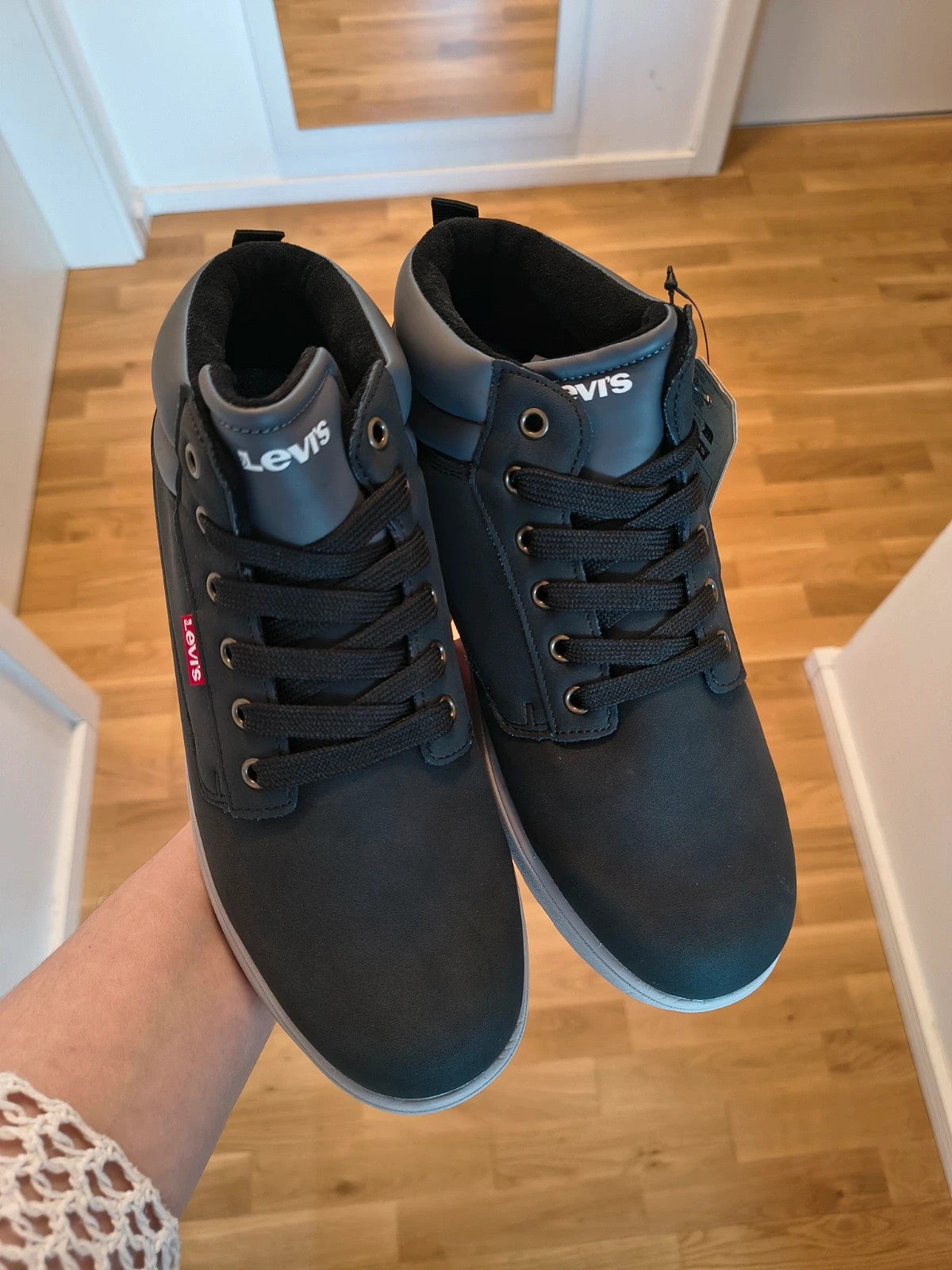 Levi's black and grey sneaker boots with logo details and padded high shaft.