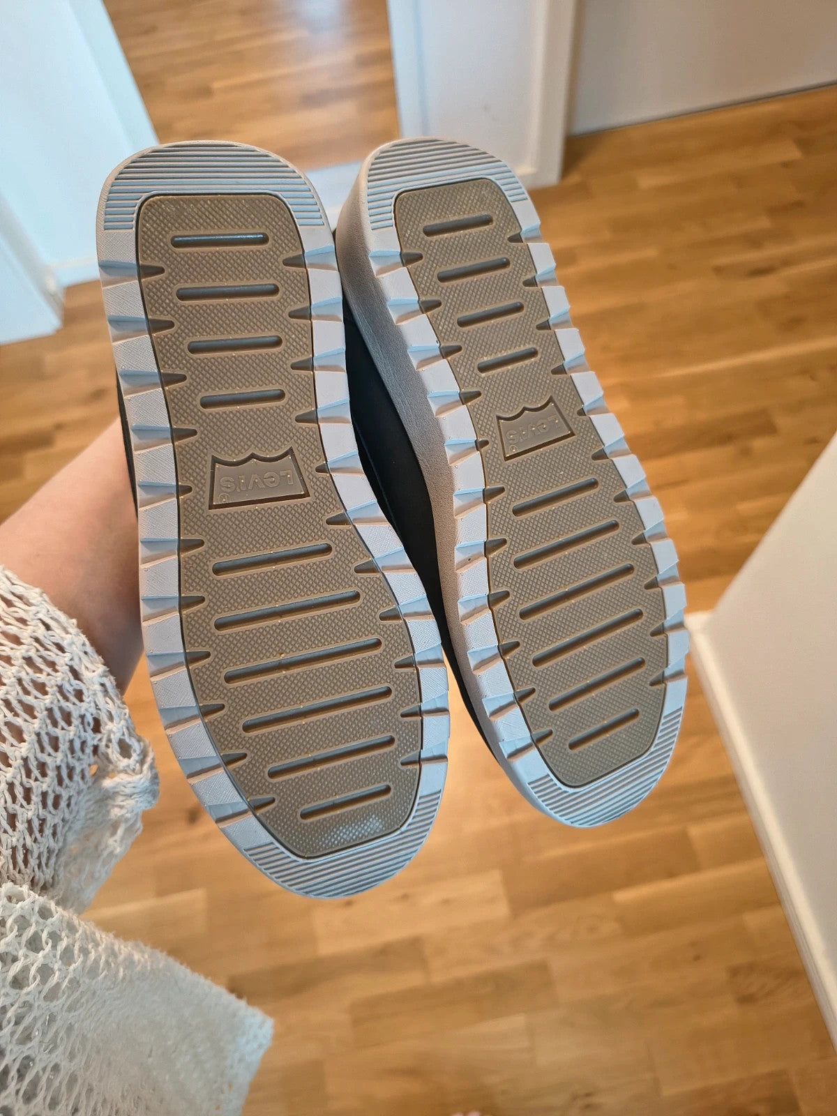 Levi's black and grey sneaker boots with logo details and padded high shaft.