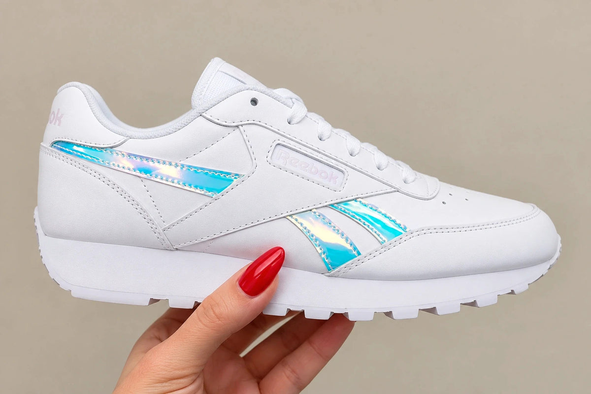 Reebok white trainers hologram details, synthetic material, classic logo design.