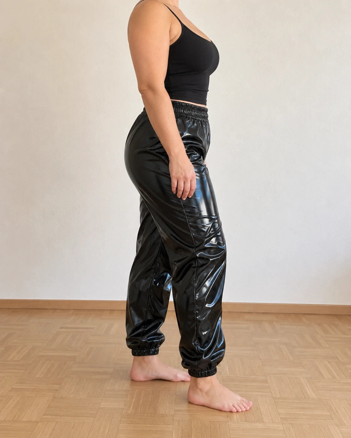 Che black joggers shiny wetlook finish with elastic waistband and cuffs.