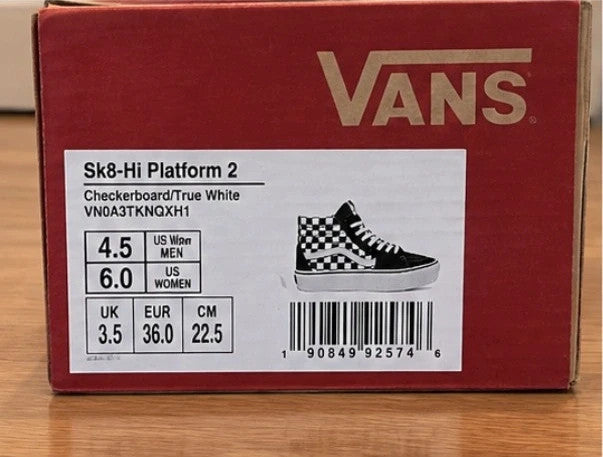 VANS black and white checkerboard high-top trainers with distinctive platform sole and logo.