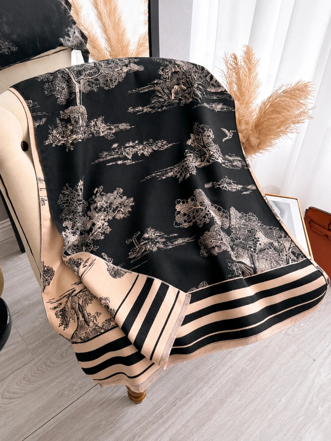 XXL beige and black reversible shawl with beautiful pattern and soft polyester material.