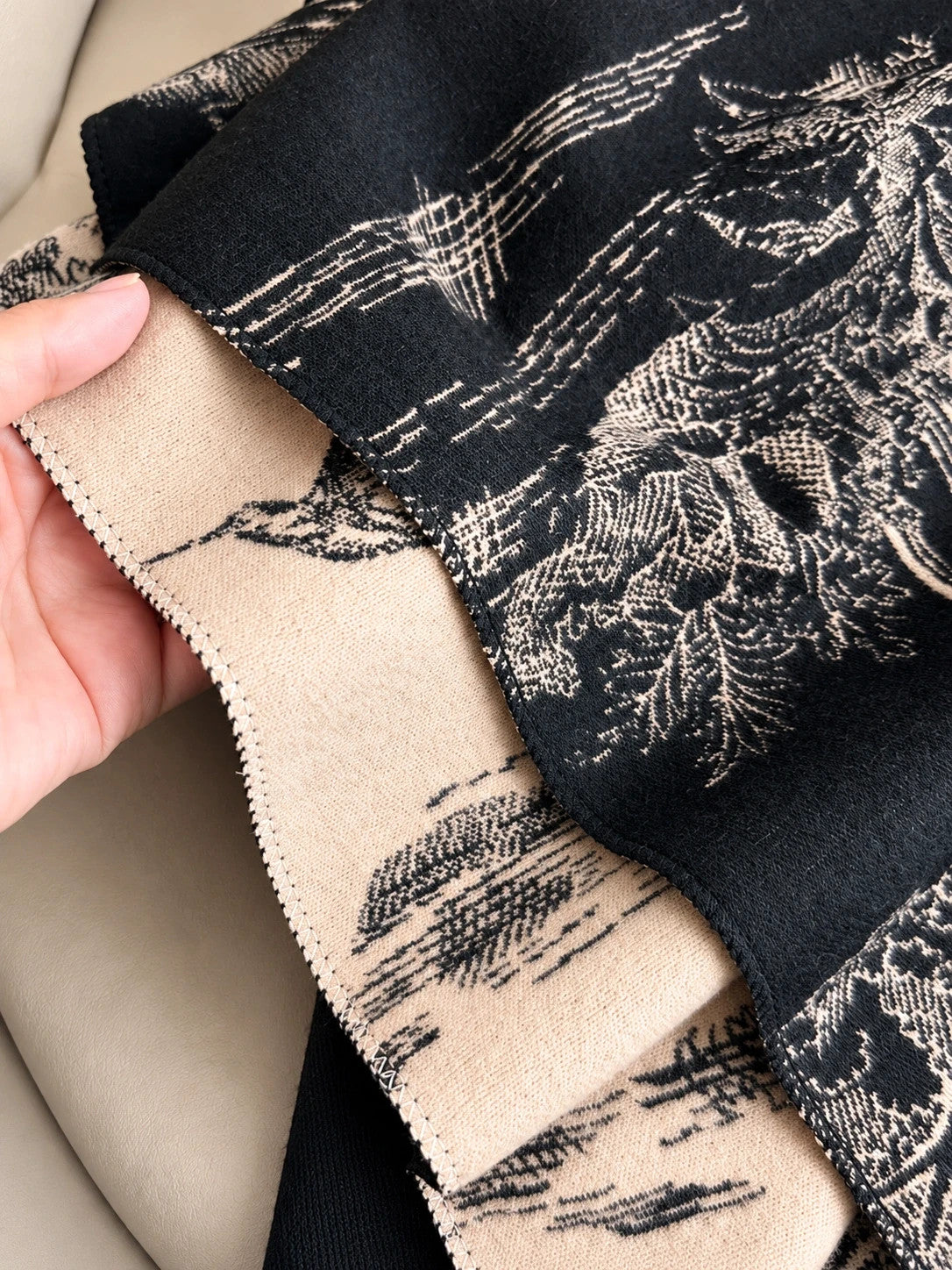 XXL beige and black reversible shawl with beautiful pattern and soft polyester material.