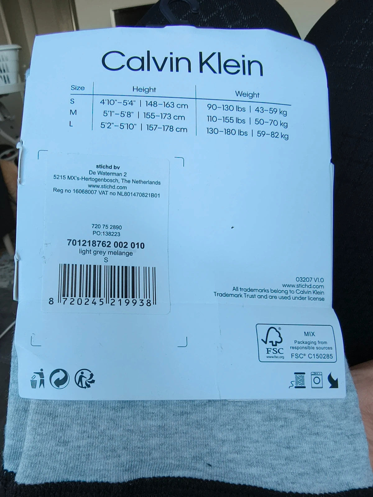Calvin Klein grey bicycle tights with wide black logo waistband, fitted design.