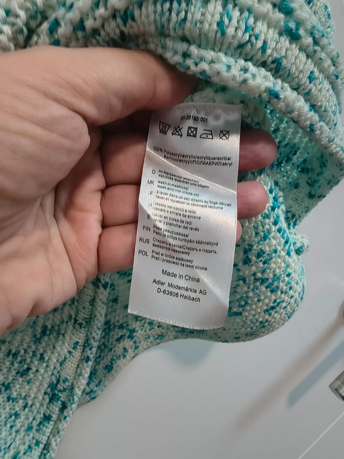 Bexleys long pullover turquoise and cream chunky knit with round neckline and relaxed fit.