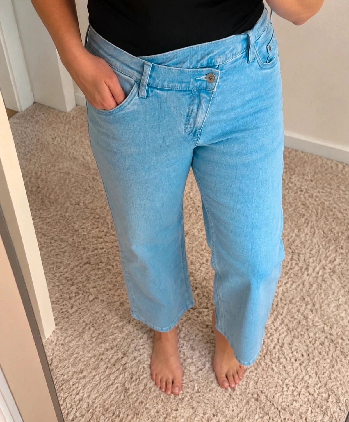 Rainbow blue straight jeans with unique overlapping waistband and two-button closure.