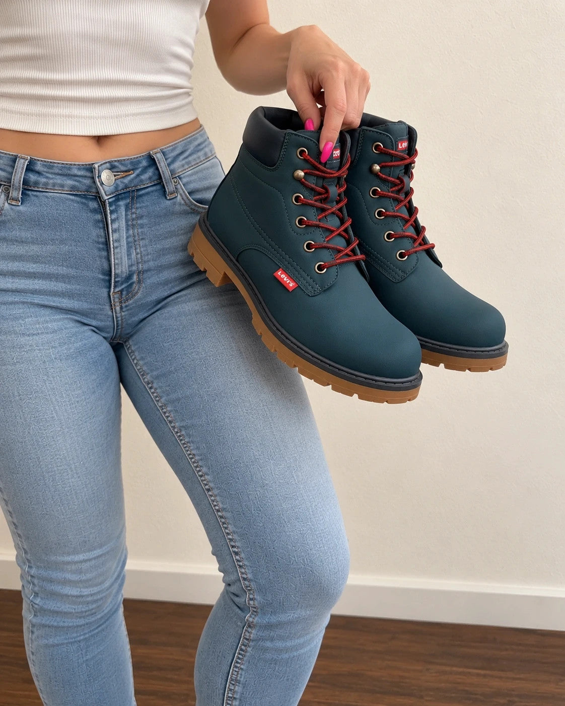 Levi's blue junior boots with contrasting laces, padded shaft, and rugged sole.