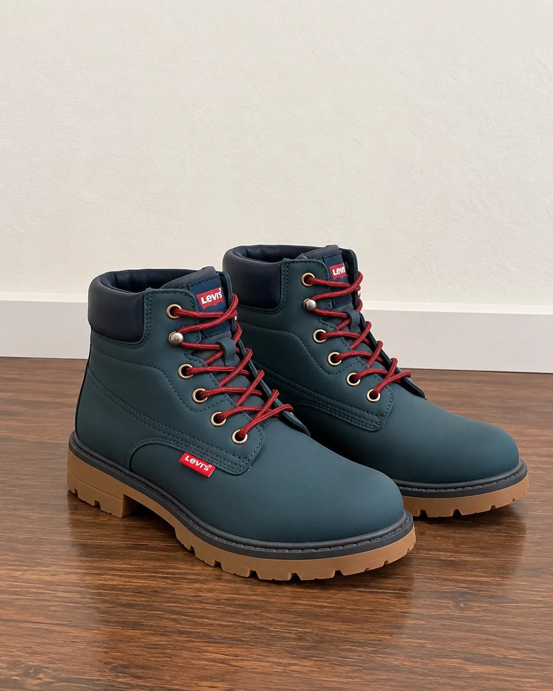 Levi's blue junior boots with contrasting laces, padded shaft, and rugged sole.