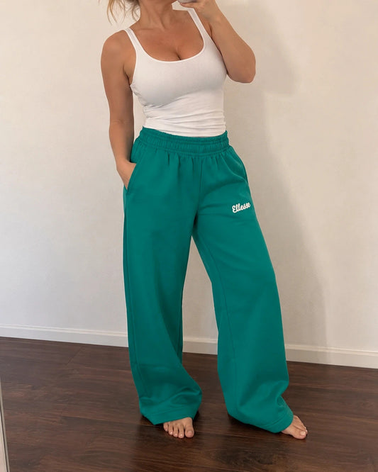 Ellesse green wide-leg jogging pants with logo, elastic waistband, and side pockets.