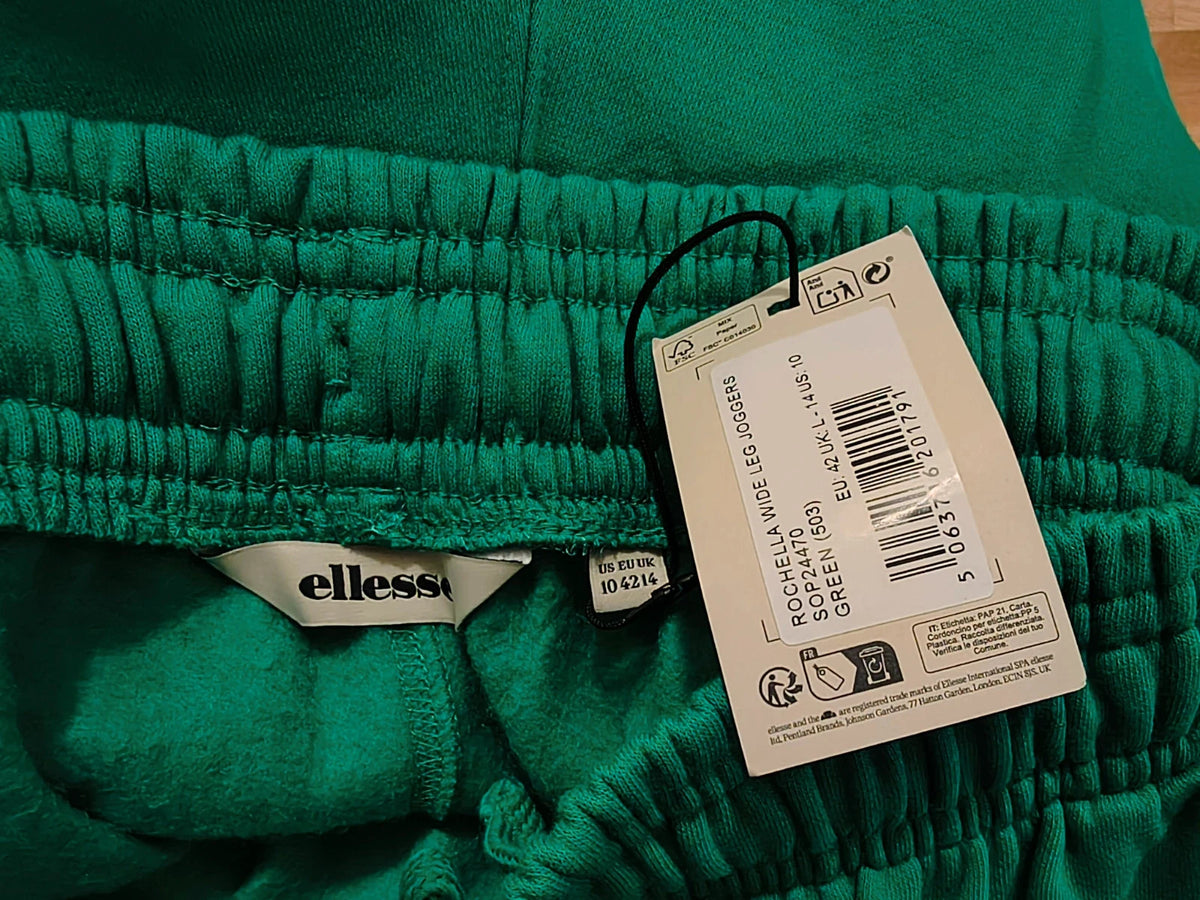 Ellesse green wide-leg jogging pants with logo, elastic waistband, and side pockets.