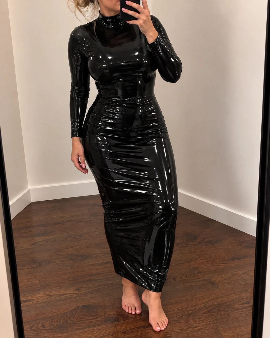 Che black maxi dress with glossy wetlook finish and long sleeves, figure-hugging design.