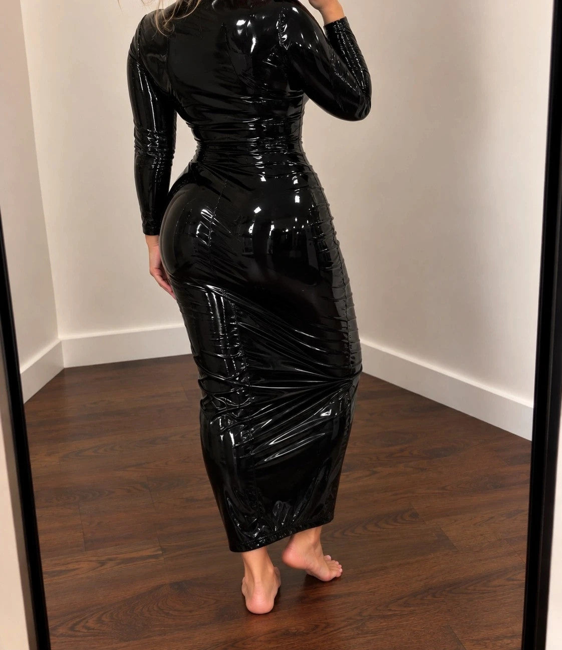 Che black maxi dress with glossy wetlook finish and long sleeves, figure-hugging design.