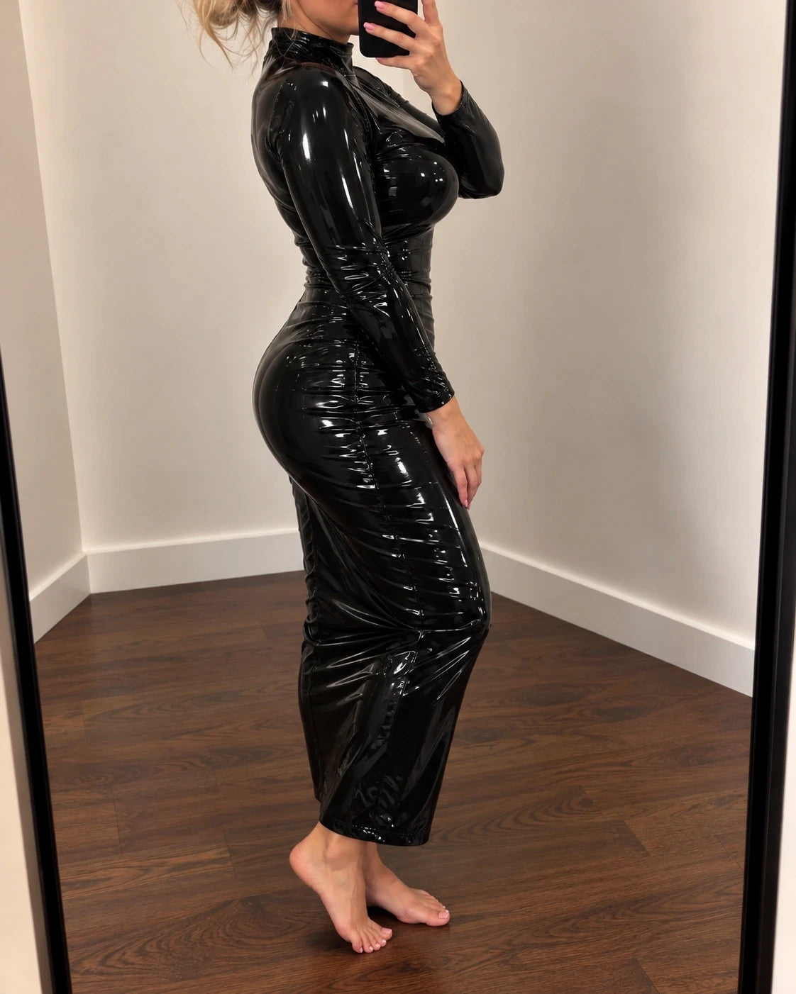 Che black maxi dress with glossy wetlook finish and long sleeves, figure-hugging design.