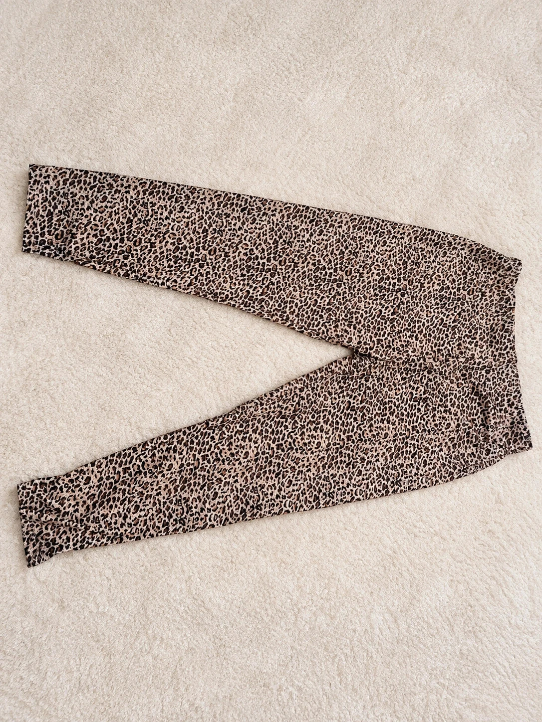 SheIn black and brown leopard print bicycle tights with elastic waistband and fitted design.
