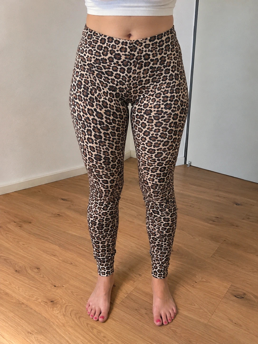 SheIn black and brown leopard print bicycle tights with elastic waistband and fitted design.
