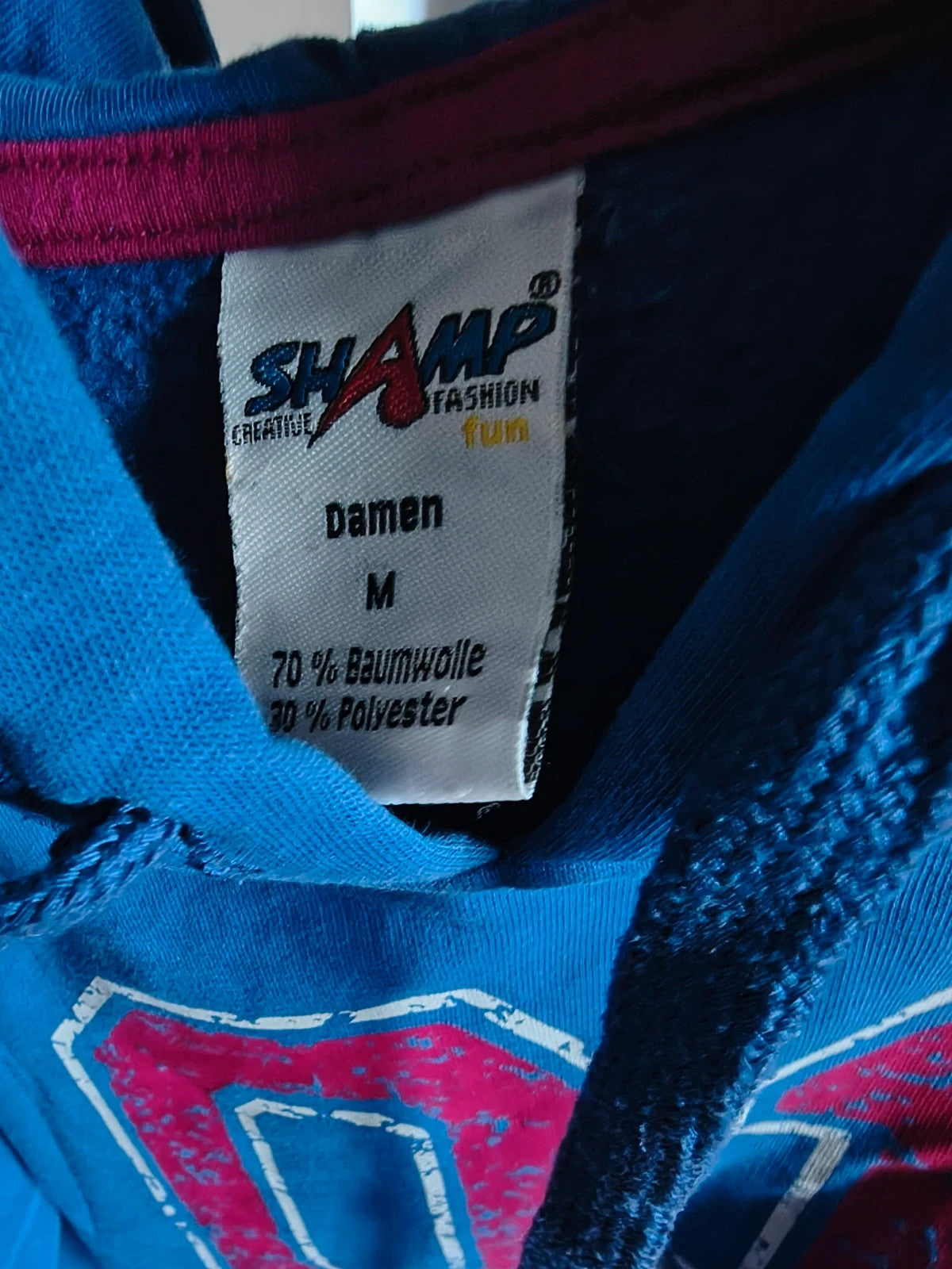 Shamp blue hoodie with large red and white 01 print, drawstring hood, kangaroo pocket.