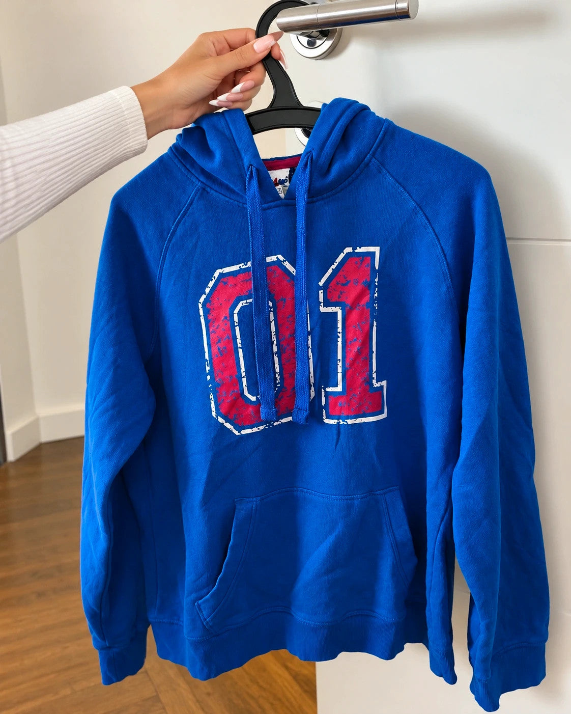Shamp blue hoodie with large red and white 01 print, drawstring hood, kangaroo pocket.