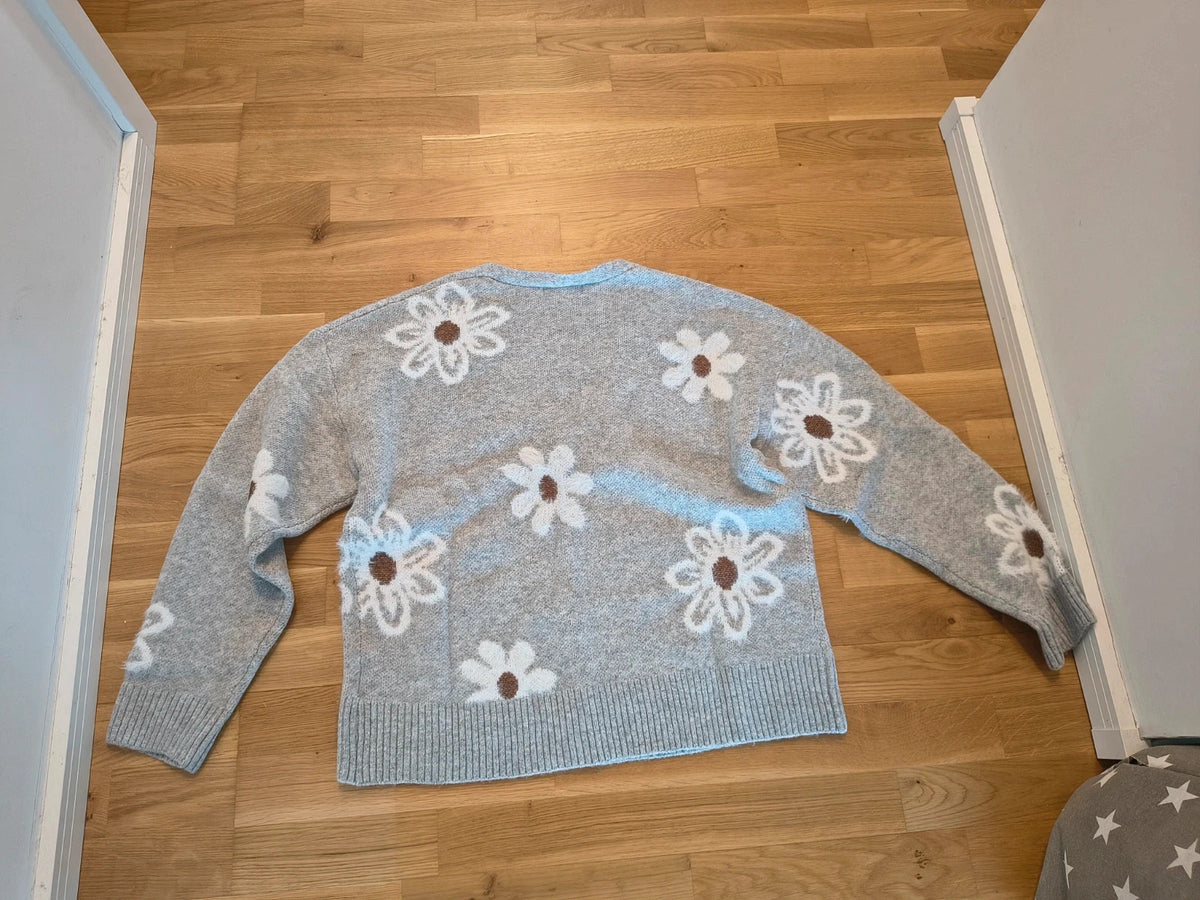 SheIn grey knit cardigan with white-brown floral pattern, V-neck, and button closure.