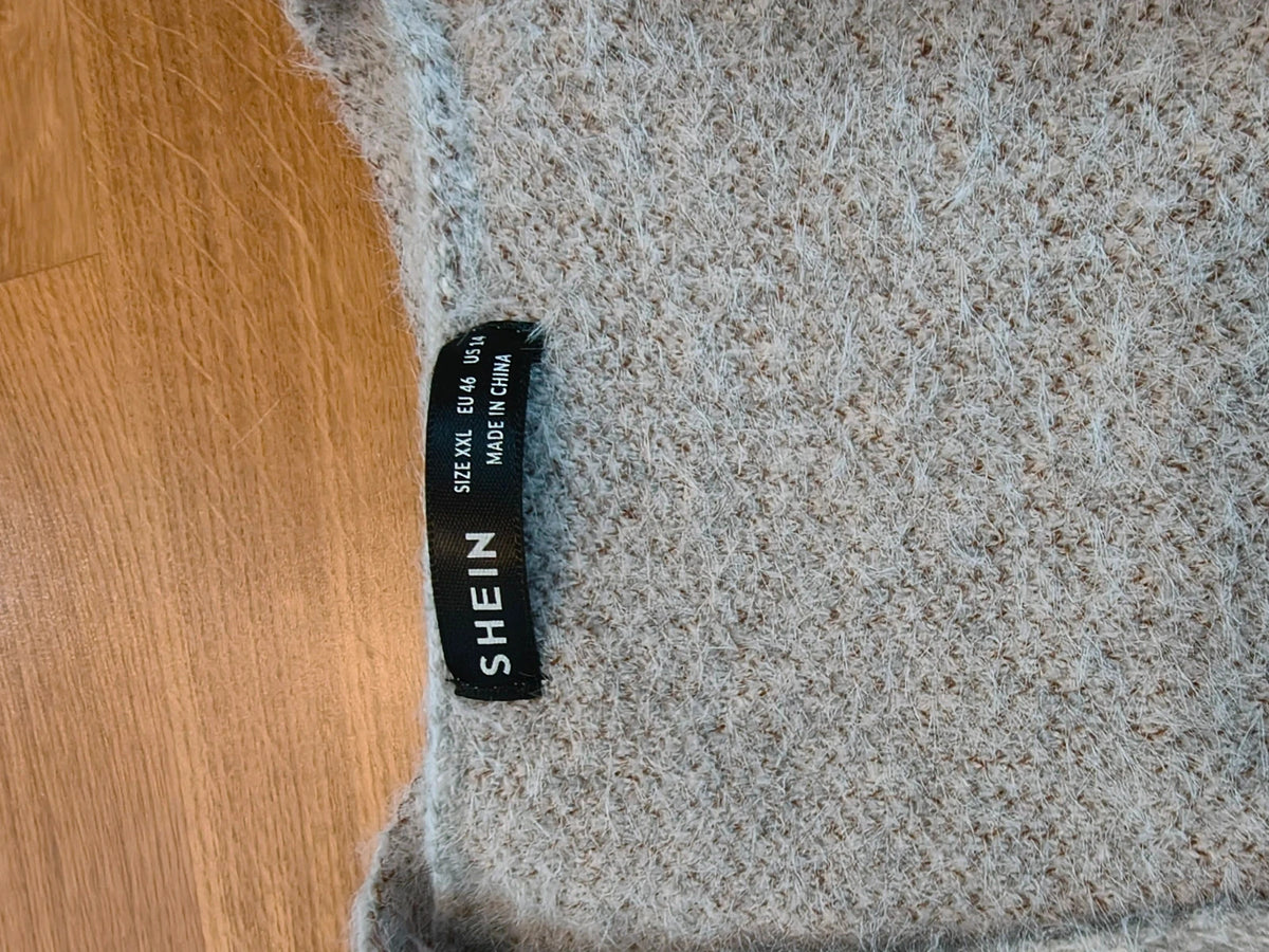 SheIn grey knit cardigan with white-brown floral pattern, V-neck, and button closure.