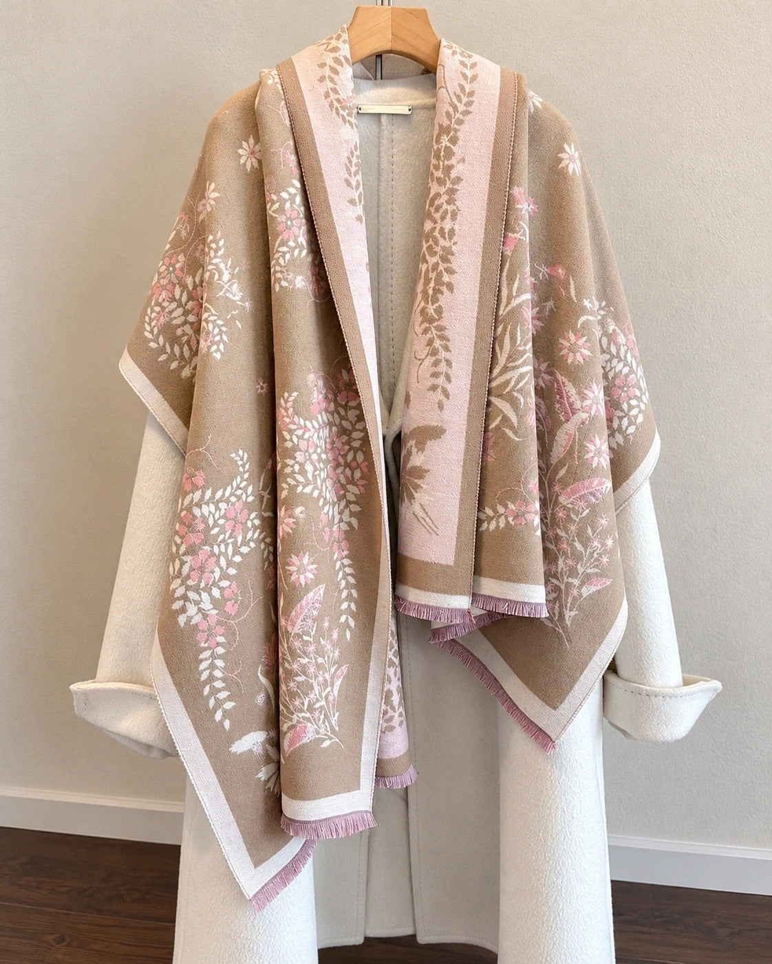 Beige shawl with pink floral pattern, reversible, soft polyester, fringed edges.