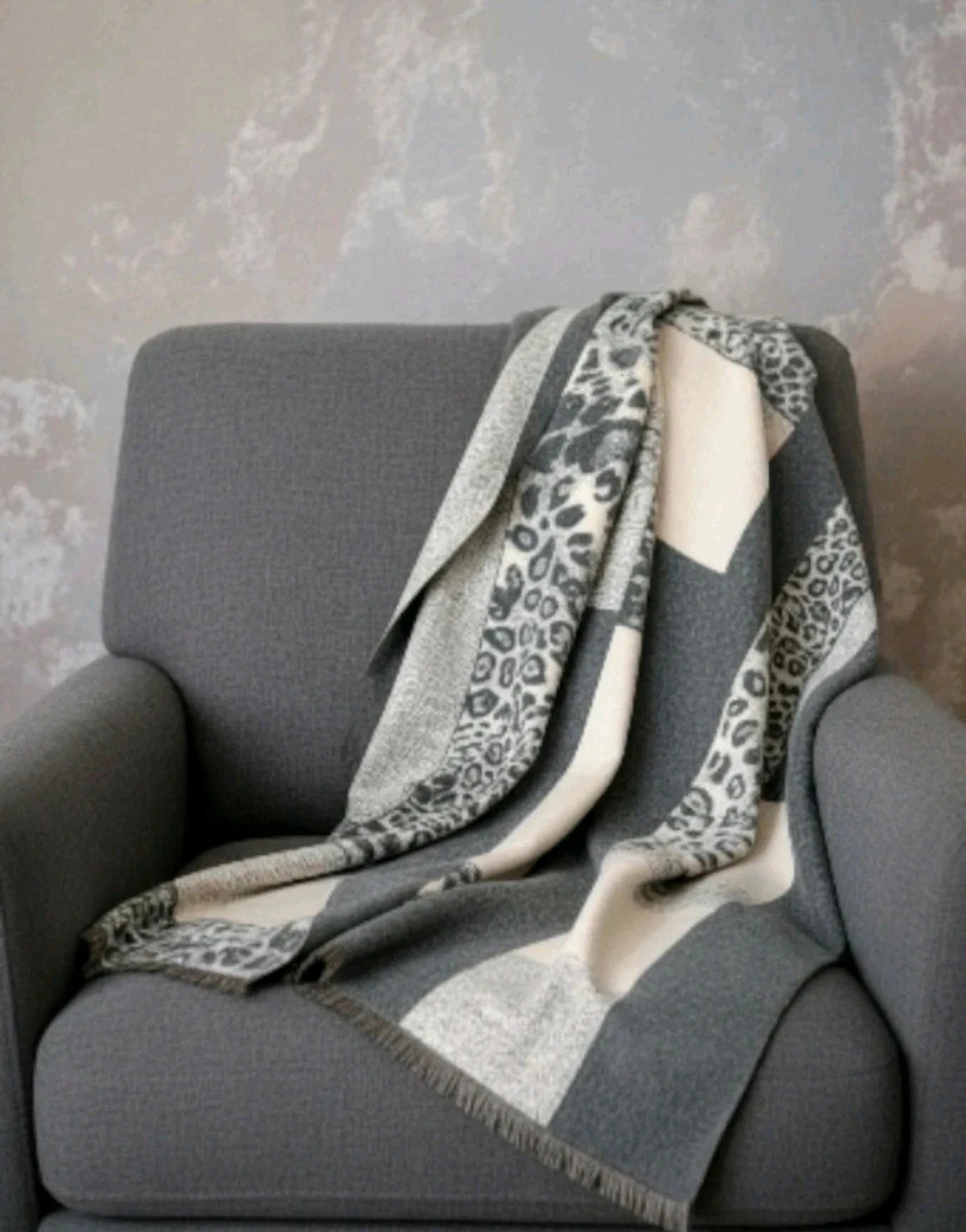 Creme reversible scarf grey and cream with leopard print and geometric patterns, fringed ends.
