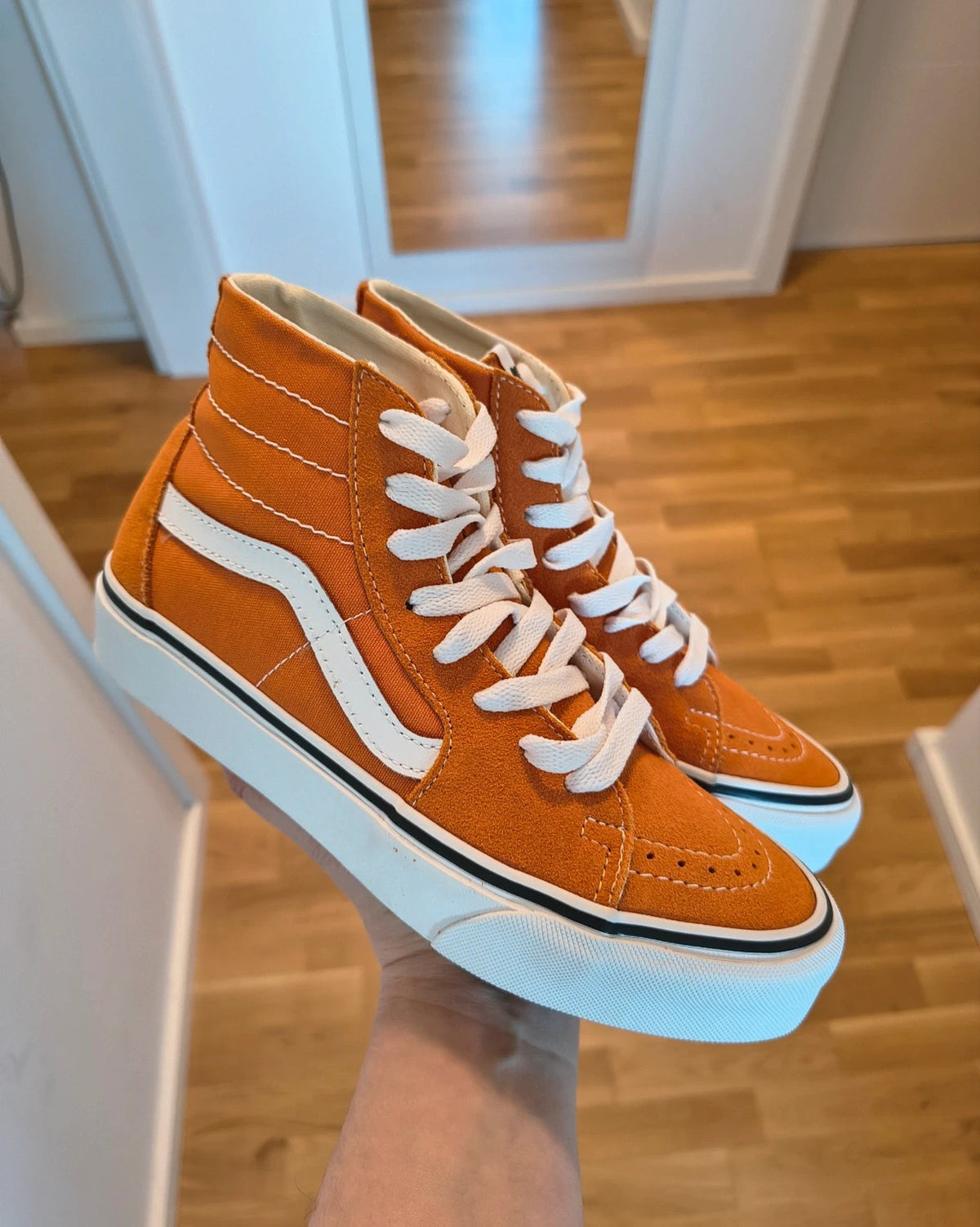 VANS Sk8-Hi Tapered trainers orange marmalade with white laces and signature side stripe.