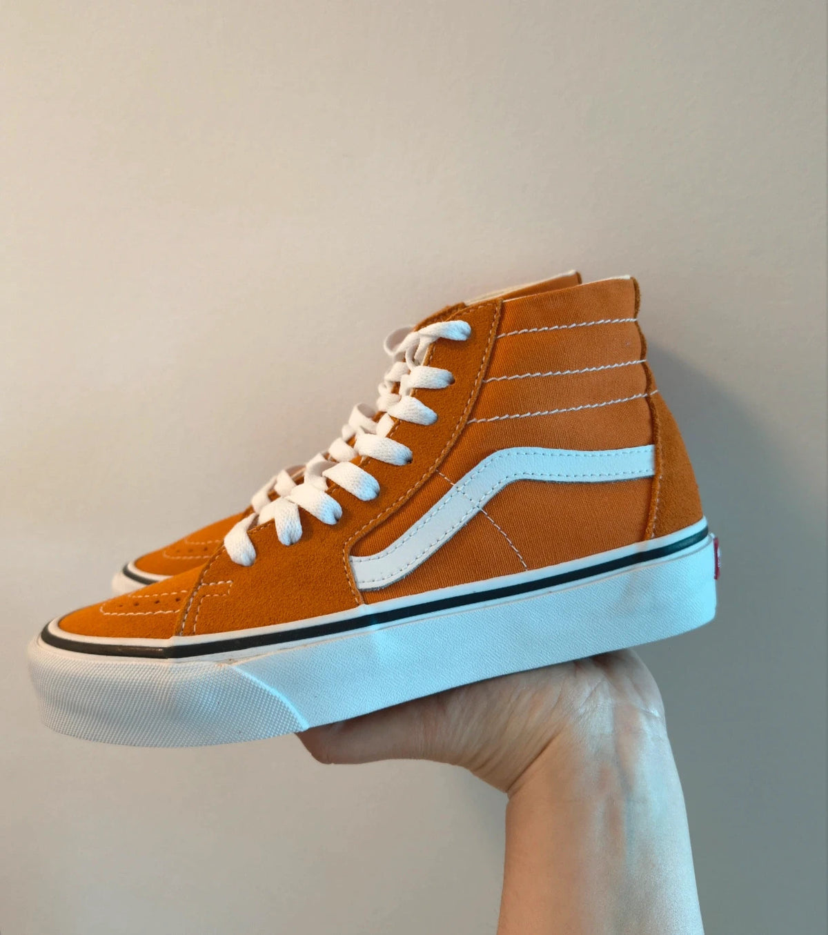 VANS Sk8-Hi Tapered trainers orange marmalade with white laces and signature side stripe.