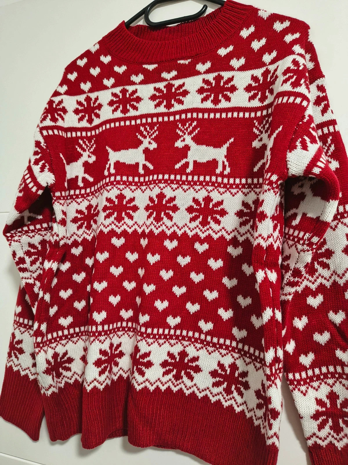 SheIn red and white Christmas sweater with reindeer, snowflakes, and ribbed cuffs.