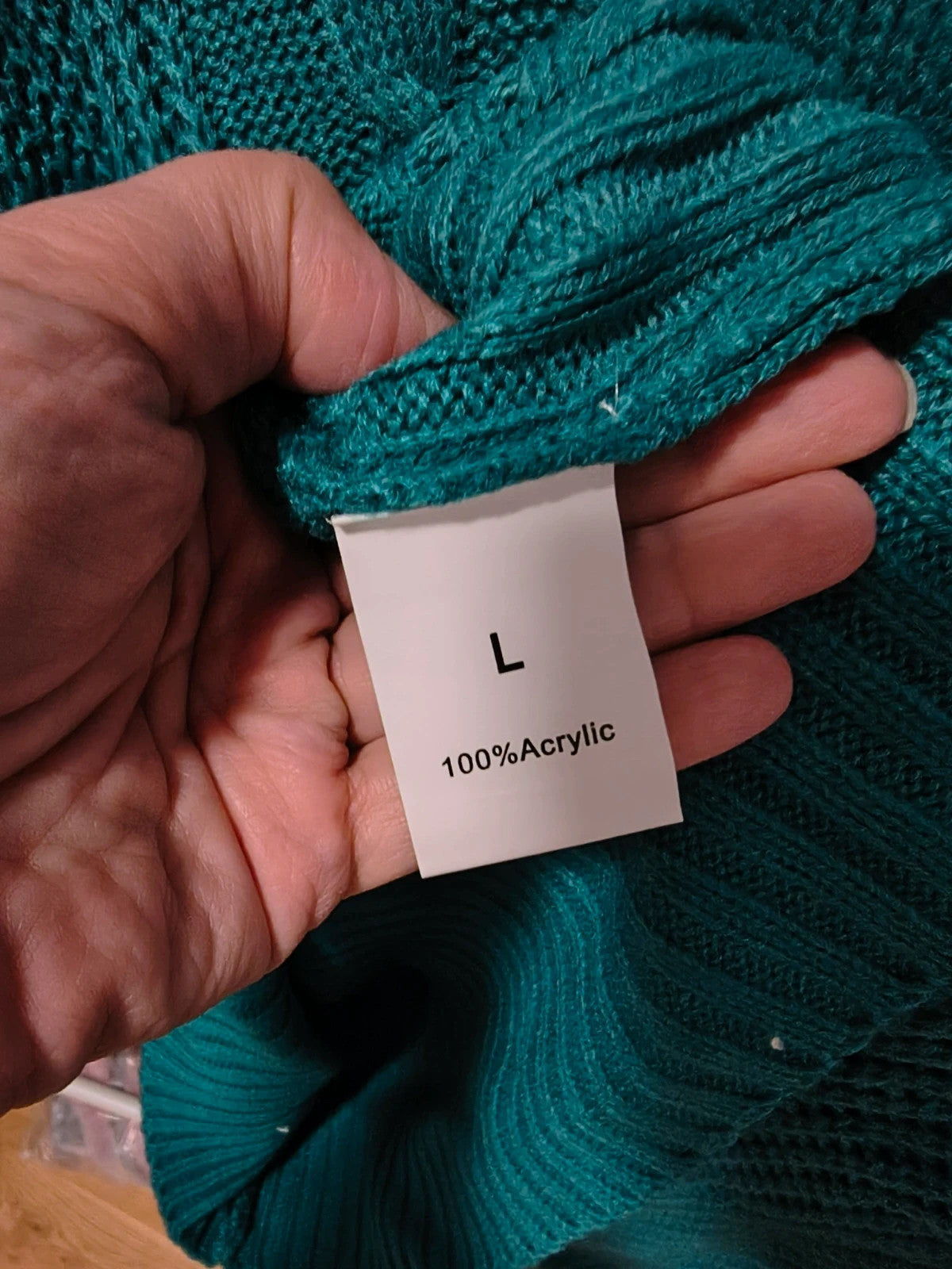 Pullover blue-green hoodie with cable knit pattern and ribbed cuffs, size L fits like M.