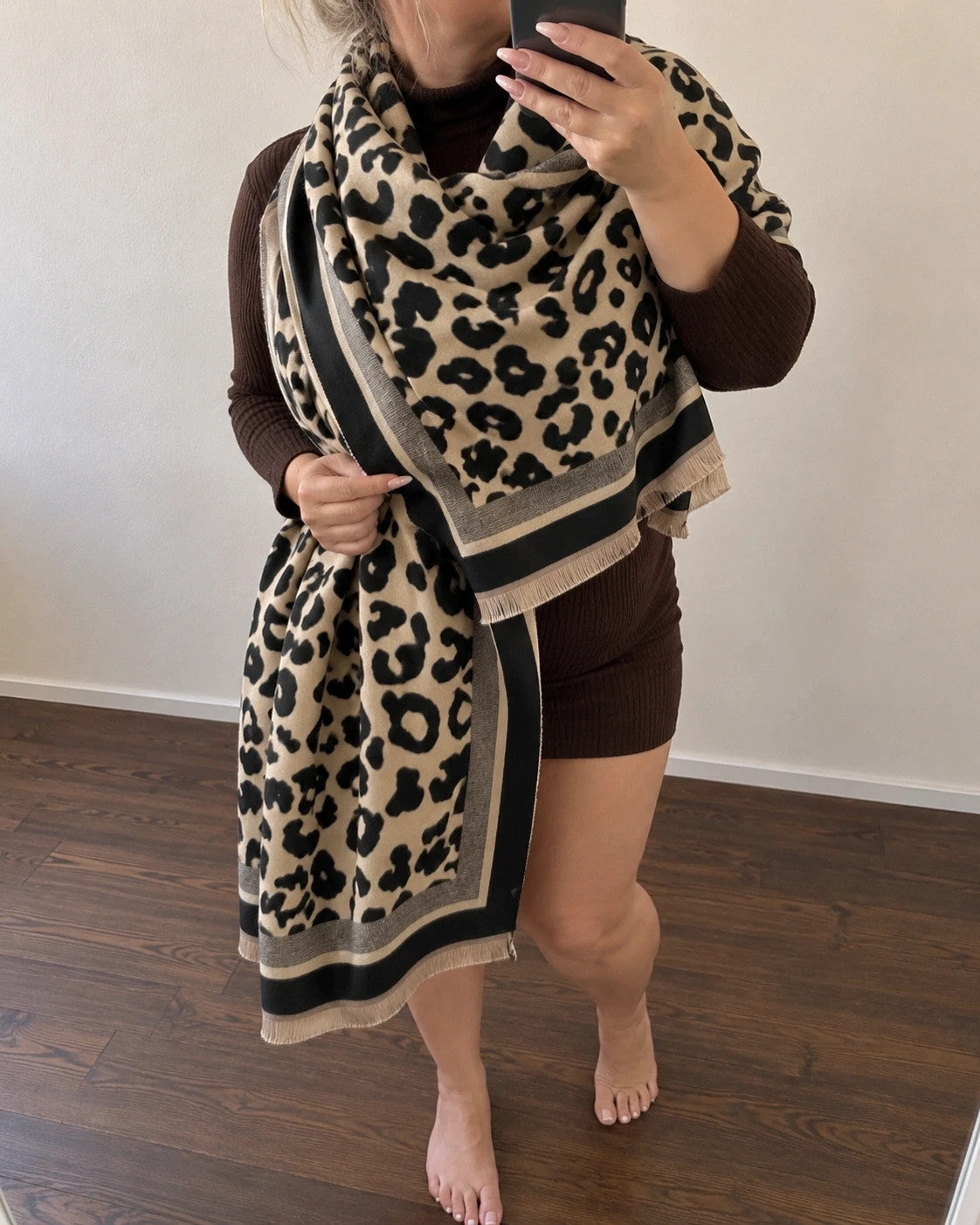 Beige shawl with leopard print, black and cream border, and fine fringes.