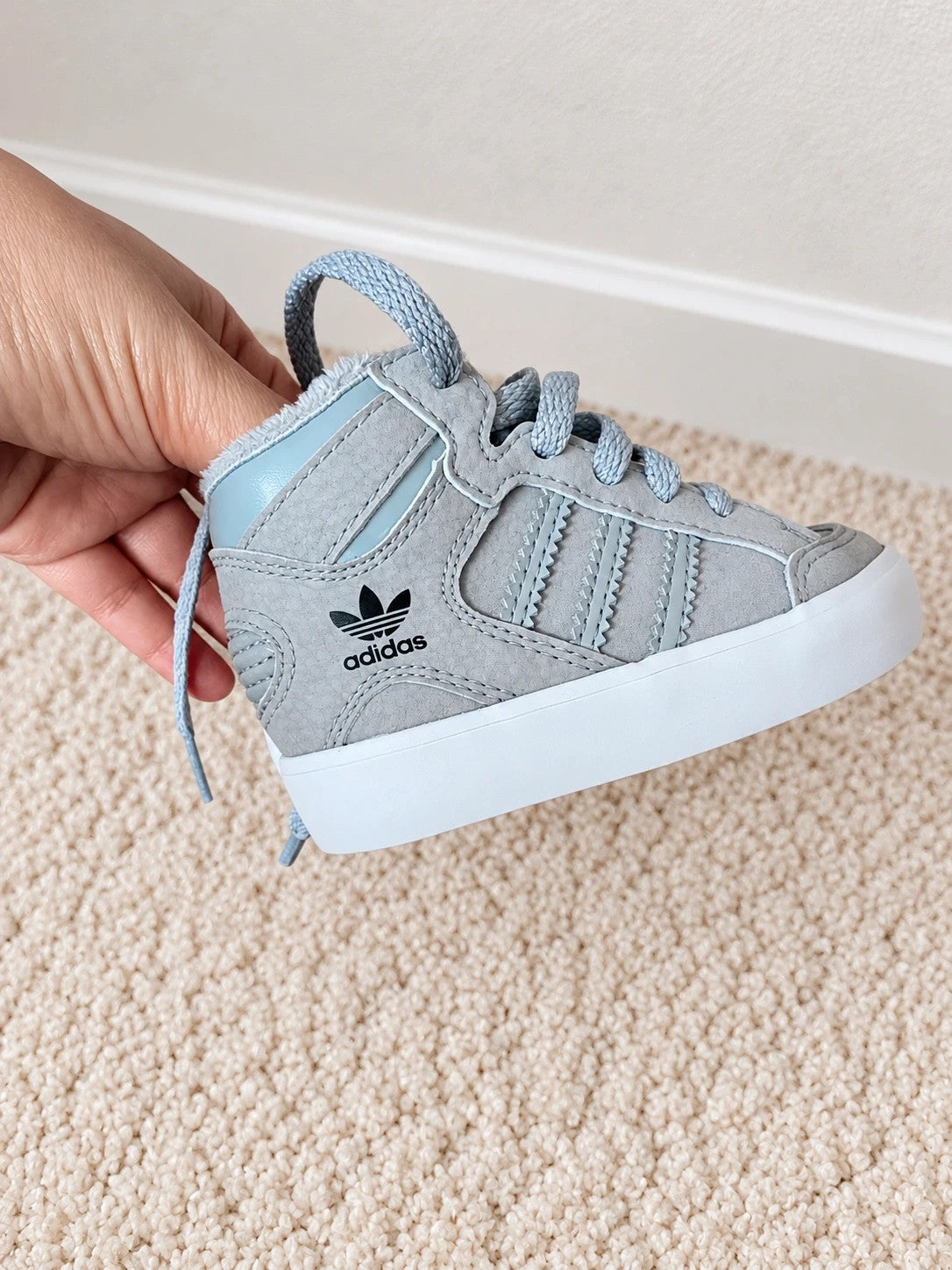 Adidas high top sneakers grey with soft lining, white rubber sole, and logo detail.