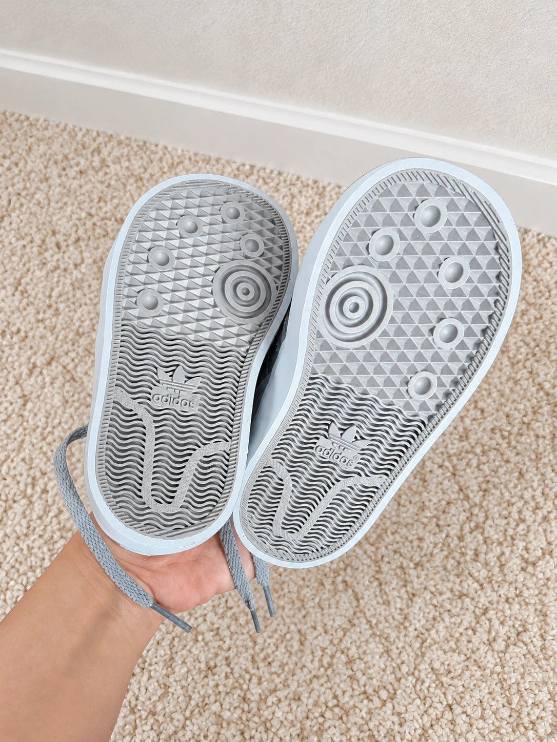 Adidas high top sneakers grey with soft lining, white rubber sole, and logo detail.