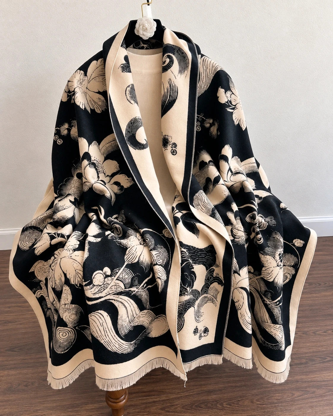 Creme black and cream shawl with floral pattern, soft polyester fabric.
