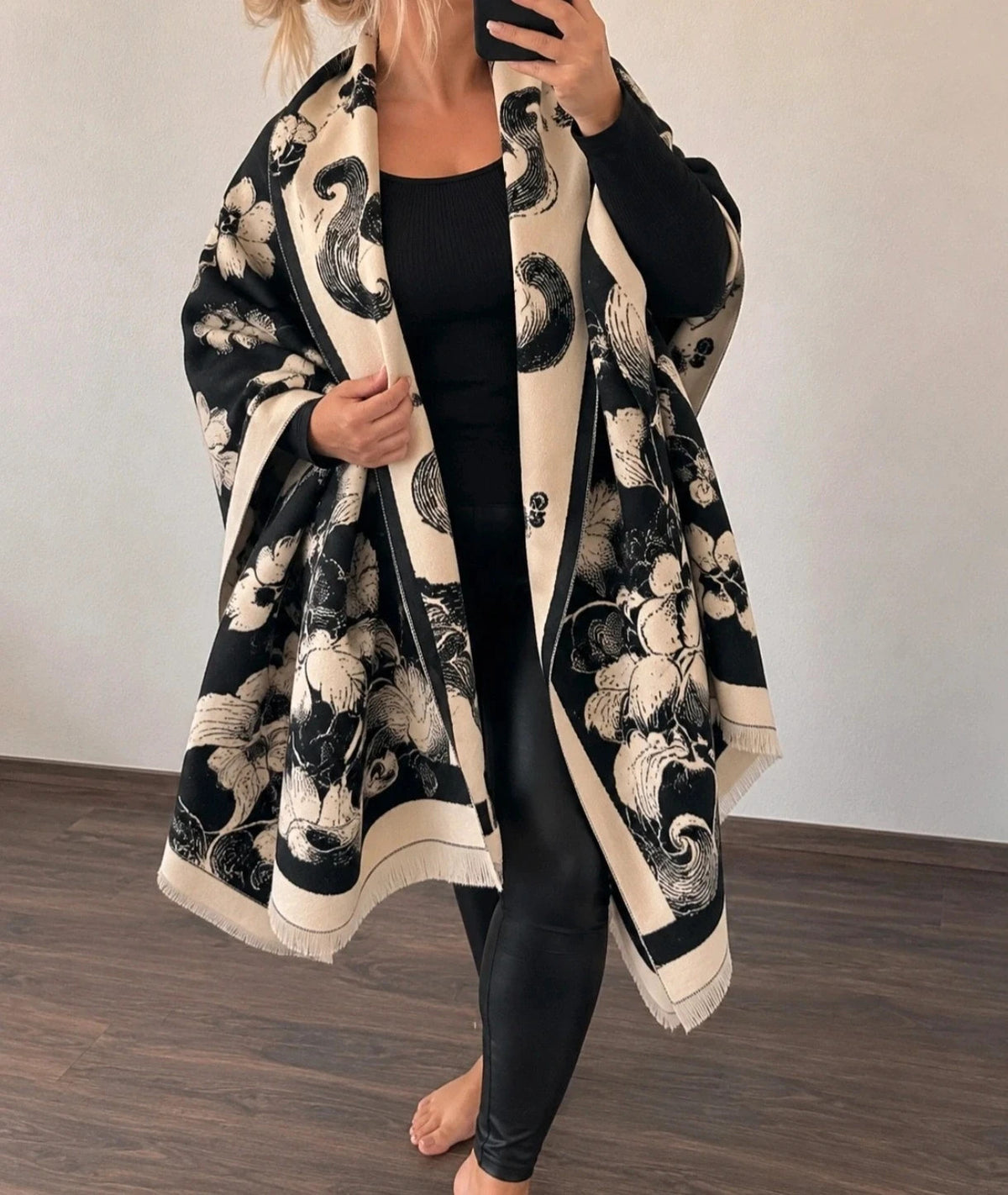 Creme black and cream shawl with floral pattern, soft polyester fabric.