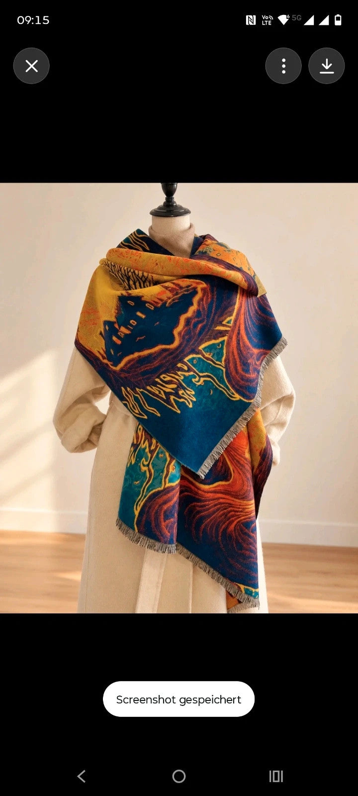 XXL multi shawl featuring a whimsical landscape design with fringed edges.