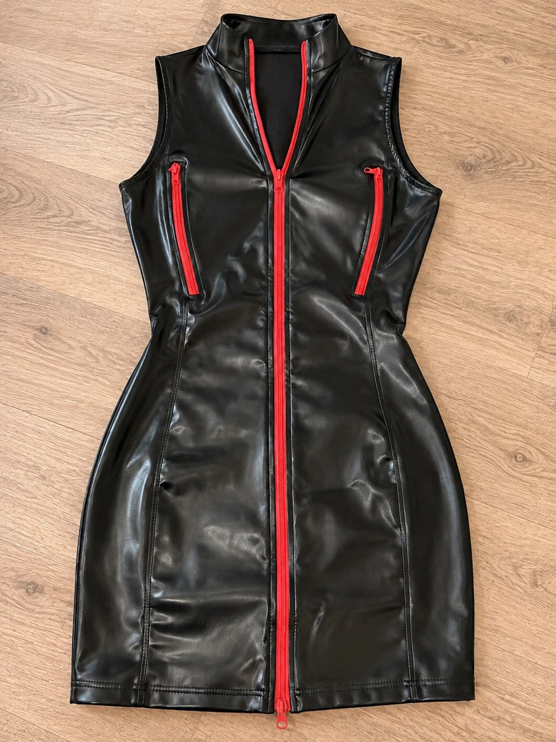 REI black bandage dress wetlook with red zippers and stand-up collar.