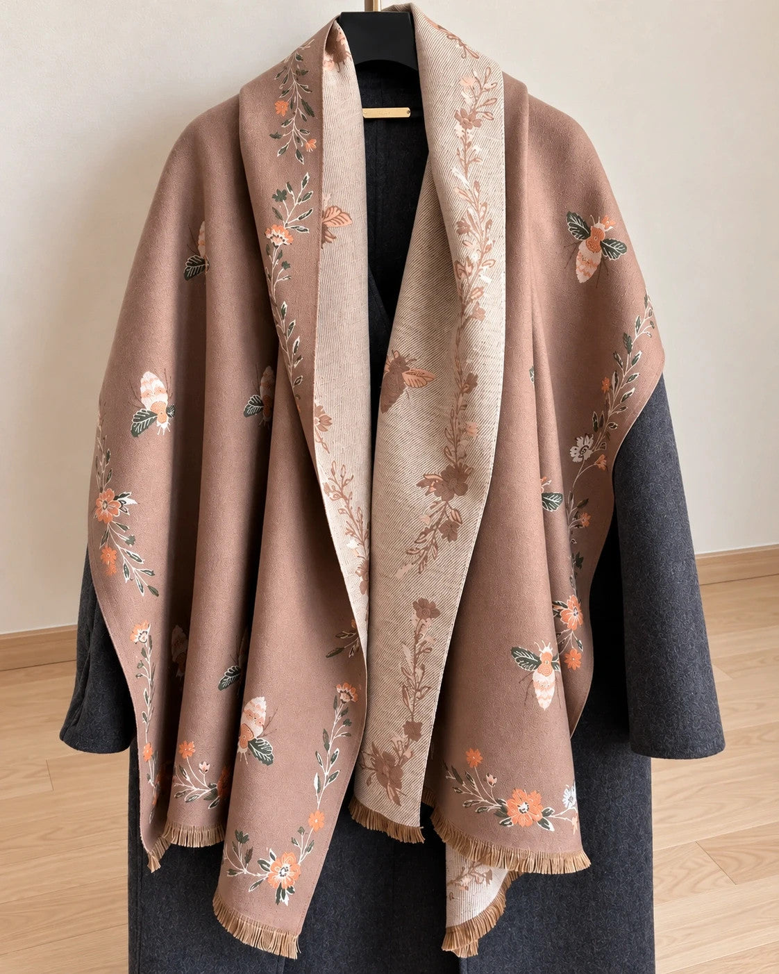 Beige shawl with brown bee and flower pattern, reversible design, fringed edges.