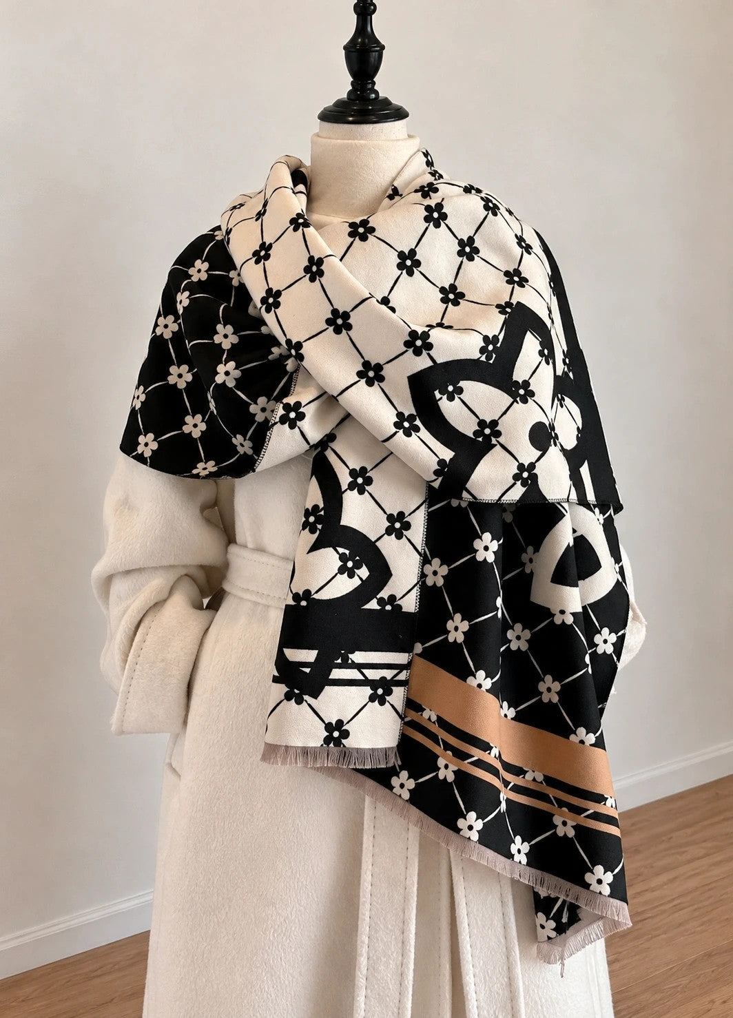 Creme shawl black cream beige floral pattern with decorative camel accents and fringes.