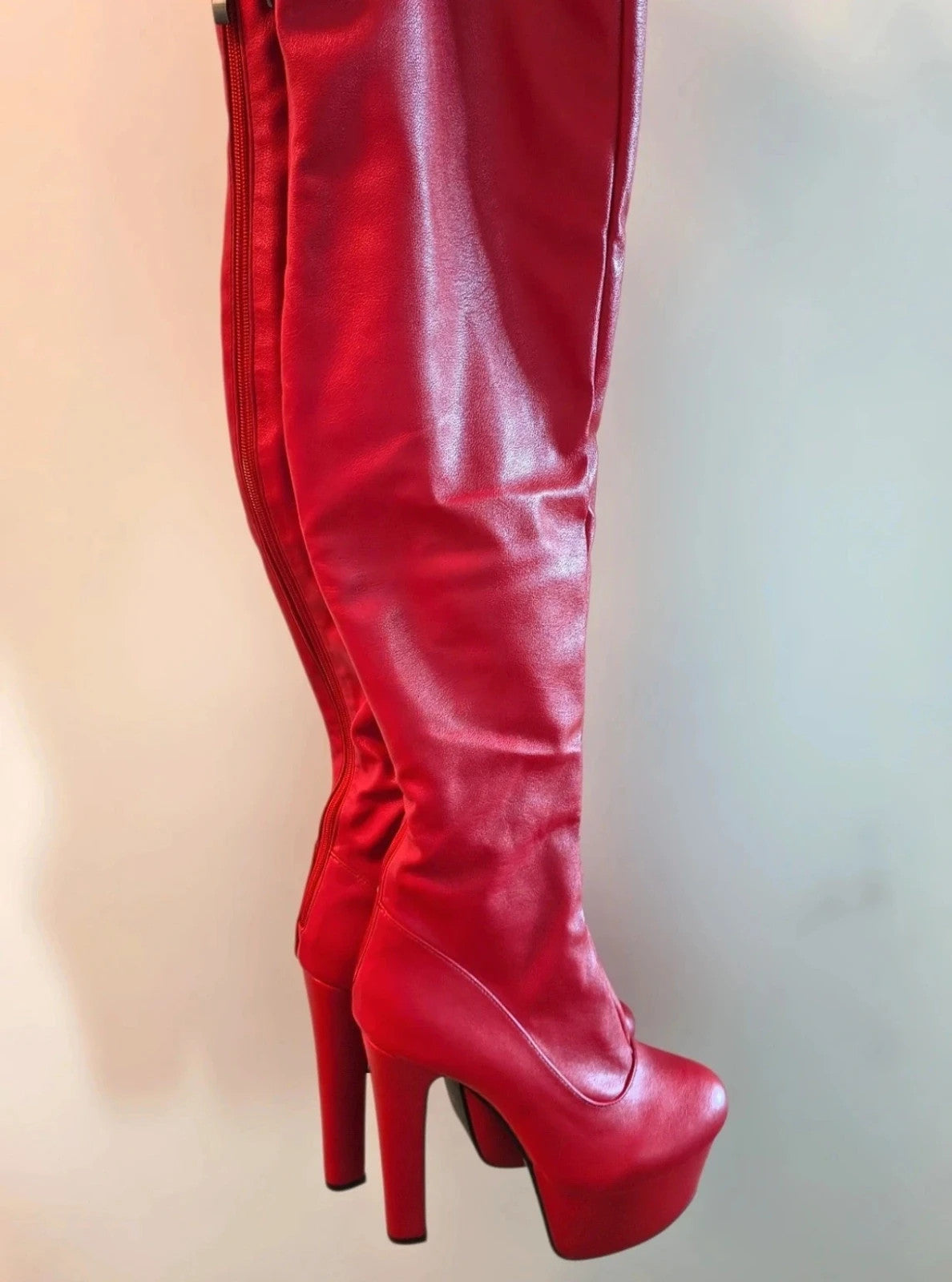 High Heels red overknee boots with high block heels and synthetic material.