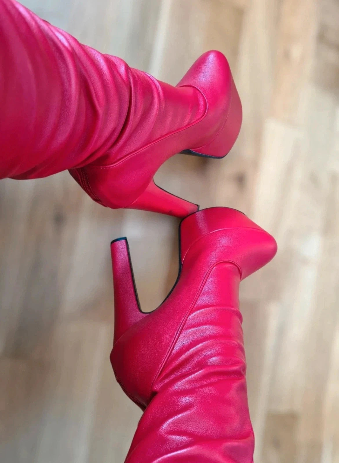 High Heels red overknee boots with high block heels and synthetic material.