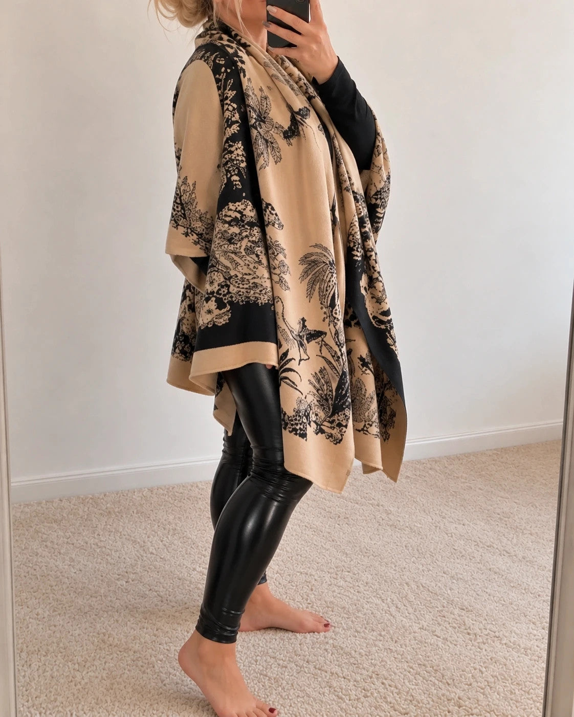 Beige shawl with black floral pattern, soft polyester material, versatile design.