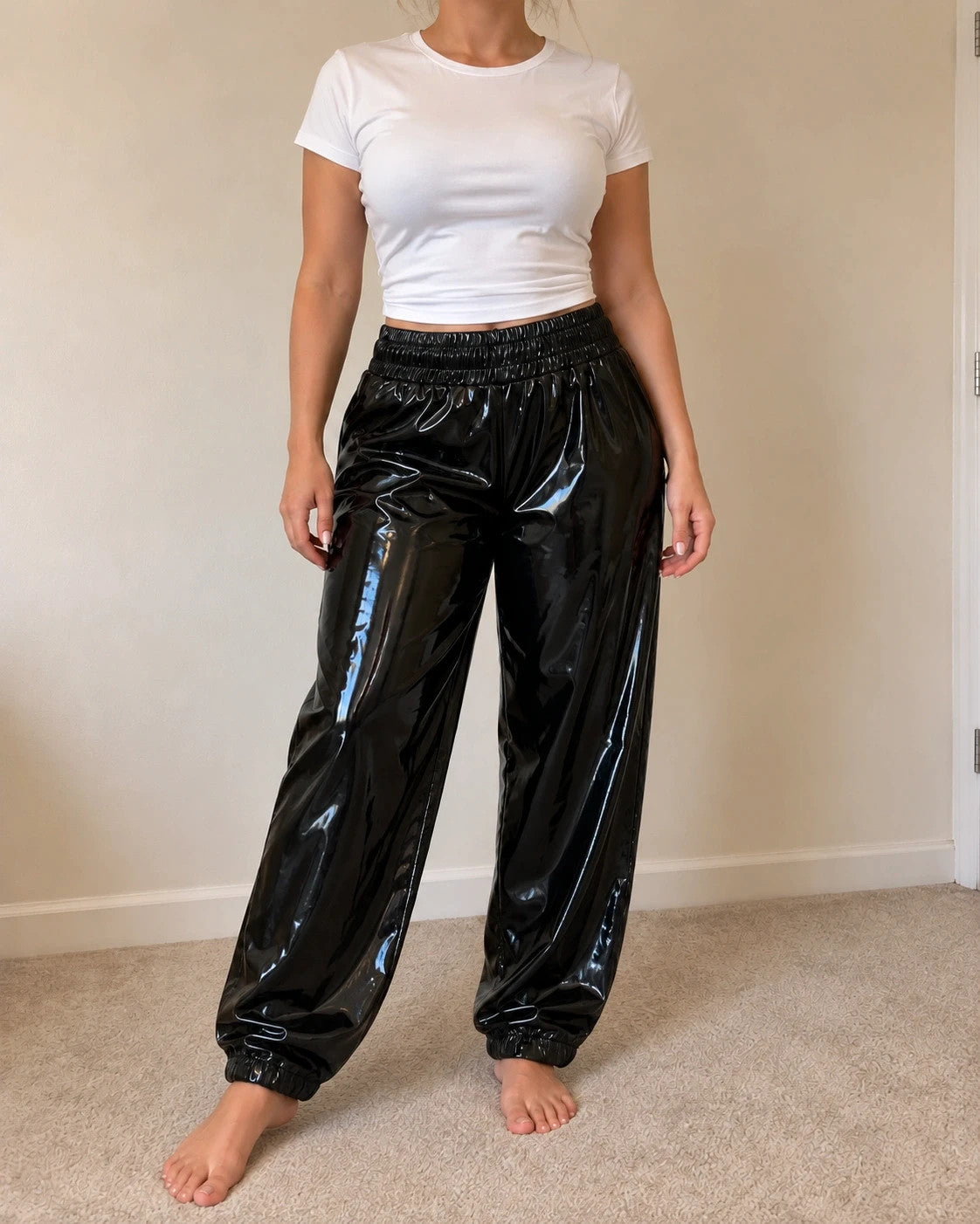 Che black jogging pants with glossy finish and elastic waistband, size L.