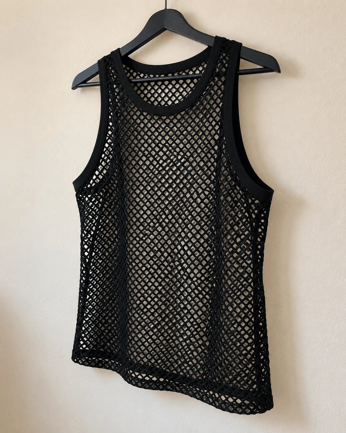 Stoff black mesh tank top with round neckline and wide straps, featuring open hole pattern.
